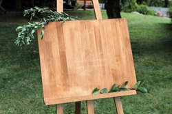 Wooden easel with a board. 