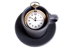 Antique pocket watch in a coffee cup isolated on white. Coffee time concept.