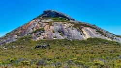 Frenchman Peak is a distinctively shaped rocky peak with a cave and a steep trail to the summit, offering ocean views.