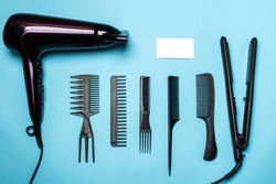 combs and hairdresser tools on blue background top viewcombs and hairdresser tools on blue background top view