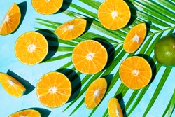 Fresh oranges on blue background. Top view.