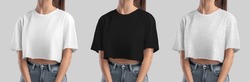 Mockup of white, black, heather crop top on girl, set of fashion clothes for design, print, pattern, front view. Template texture wear, free cut t-shirt, women's shirt isolated on background.