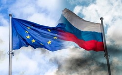 Russian and EU flags covered by black smoke, concept picture about sanctions and conflicts