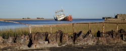 Abandonded ship sink in the ocean near de coast