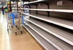 Empty shelves at a supermarket due to stockpiling during the coronavirus pandemic