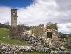 Old church tower of the abandonded haunted village of Ochate, Trevino Country, Burgos, Spain
