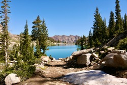 Bright blue apline lake with mountain backdrop - White Pine Lake in Little Cottonwood Canyon, Utah