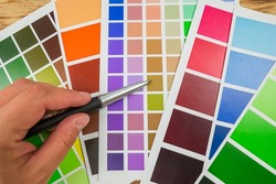 Color palette, guide of paint samples, colored catalog.hand choose color in palette samples. Rainbow colors catalogue
