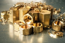 Hexagonal bars and brass products made on CNC metalworking machines. Manufacturing of parts from brass. 