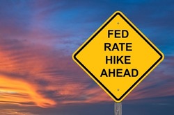 Fed Rate Hike Ahead Caution Sign - Sunset Background