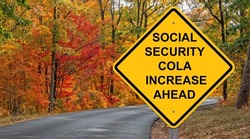 Social Security Cola Increase Ahead Caution Sign - Autumn Background