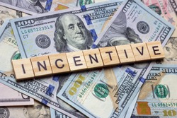 The word incentive on dollar usa background