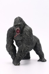 toy gorilla. plastic miniature figurine gorilla isolated on white background