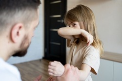 The concept of violence and abuse in the family. Father punishing his child.