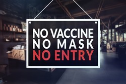 A no vaccine, no mask, no entry sign at a restaurant, cafe or other establishment.