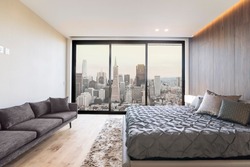 Modern and contemporary bedroom in San Francisco with views of the financial district of the city. Condo or Hotel accommodation.