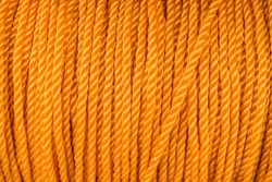 A spool of yellow polyethylene nylon rope for sale at a fishing supply store.