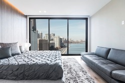 Modern and luxurious master bedroom with views of Chicago and Lake Michigan. Condo or Hotel accommodation.