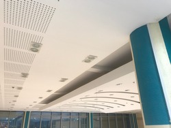 Curved Gypsum false ceiling designs of an buildings like shopping mall public building interiors and architecture painted with emulsion painted smooth matt finish