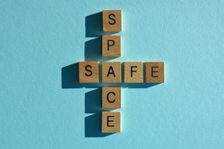Safe, Space, words in wooden alphabet letters isolated on blue background
