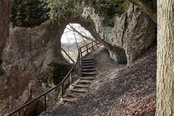 Hiking trail and rock tunnel at Klosterfelsenweg near Inzigkofen Princely Park, Upper Danube Nature Park, Baden-Wuerttemberg, Germany.