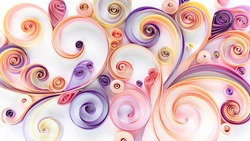 Quilling paper art background. Abstract pattern of curls and rolls of cut colored paper. Filigree paper hobby. Floral pattern in pink and purple tones.