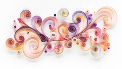 Abstract panel made of colored paper scrolled into curls and rolls. Quilling banner on a white background with copy space. Quilling paper art as a hobby.