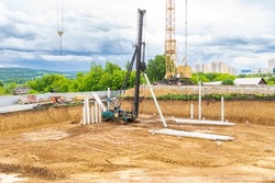 construction work in a pit - a pile foundation for a heavy structure with soft soils, selective focus