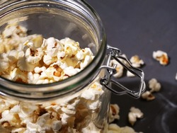 Popcorn in a glass jar medium shot selective focus