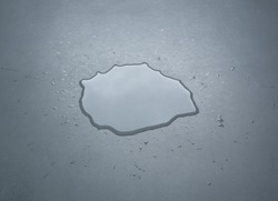 Liquid or water drops splash on the floor , Dark color tone, abstract background