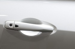 White car door handle. Selective focus