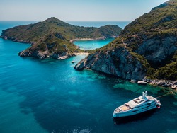 A luxury private  yacht anchored on porto timoni beach in corfu