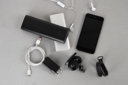 Mobile accessories include white and black power bank, wireless headphone adapter and smartwatch and type C cable