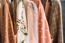 Capsule clothes in beige and pink colors closeup