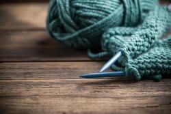 Blue knitting wool and knitting needles 