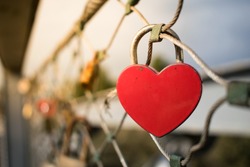 Heart-shaped love lock hanging on a bridge in Tel Aviv, Israel. Valentine's Day background.