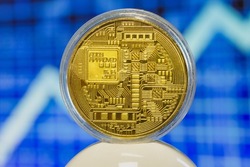 Back side of symbolic bitcoin coin on stock market chart background. Bitcoin money in transparent protection box. Cryptocurrency, stock market, blockchain, digital money concept.