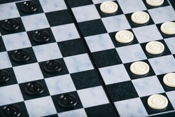 Background, checkers board with checkers, checkers is logical game for two
