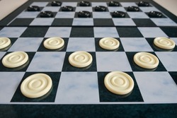 Background, checkers board with checkers, checkers is logical game for two