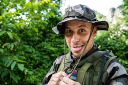 Special force military soldier portrait wearing hat in battle zone
