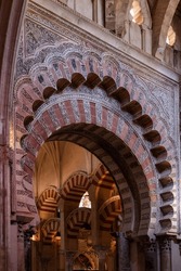 Decorated horseshoe arch that gives entrance to what was the prayer room of the cathedral mosque of Cordoba.