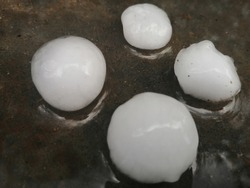 Large Hailstones (Hail Ice Balls) on ground after hailstorm,hail are large in size,selective Focus, close-up.