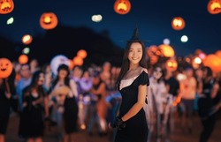 Asian woman dressing witch and wizard costume in halloween night party for woman in witches hat and costume Wide Halloween party art design.