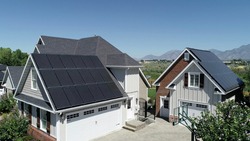 Black solar panels on roof of home. Electricity reduced from high quality black solar panel installation
