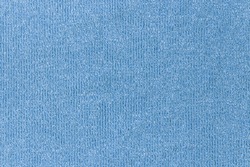 abstract background of light blue knit fabric texture close up
