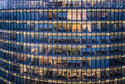 skyscraper Office windows and office worker by night square pattern