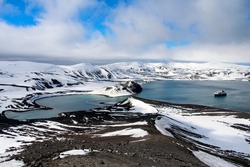Deception Island is an island in the South Shetland Islands archipelago, with one of the safest harbours in Antarctica.