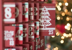 Photograph of a Wooden Advent calendar with the focus on door 25