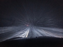 Ride through the night snow blizzard in the countryside of Russia.