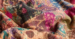 Stunning colourful Indian patchwork quilt with the traditional Kantha running stitch embroidered by hand running from top to bottom
